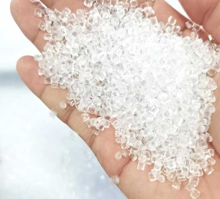Hand holding 100% virgin SABIC polycarbonate granules for premium sheet manufacturing