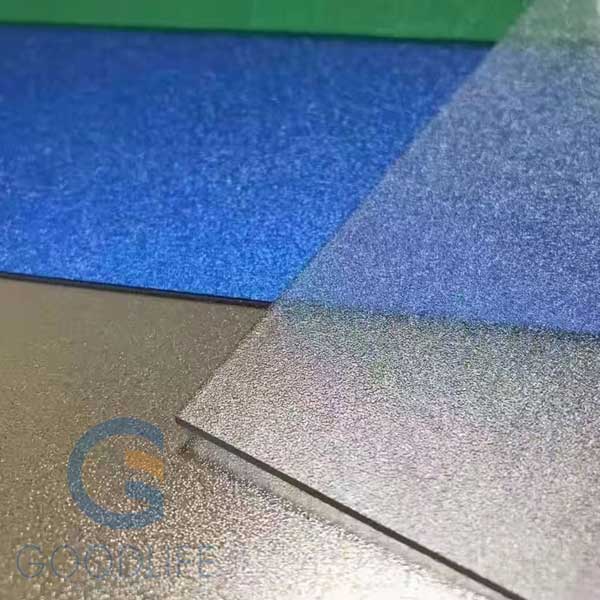 Stacked frosted polycarbonate panels displaying frosted surface texture and edges